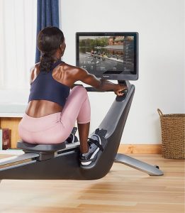 woman exercising on a rowing machine